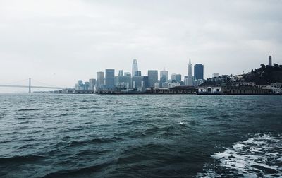 Sea with city in background