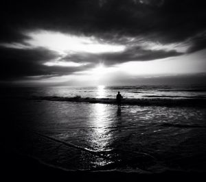 Scenic view of sea against cloudy sky