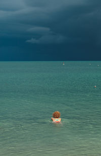 Woman swimming in sea