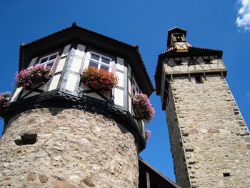 Low angle view of building against blue sky