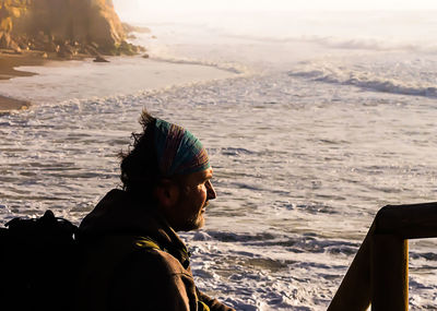 Portrait of man sitting in sea