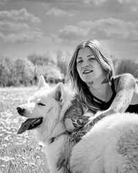 Portrait of young woman with dog