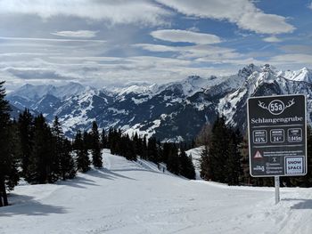 Scenic view of mountains against sky during winter