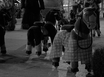 Horse toys at amusement park during night