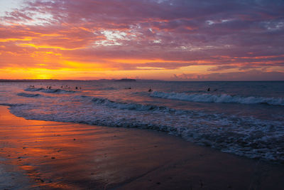 Scenic view of beach against sky during sunset