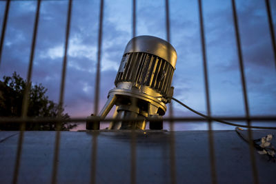 Close-up of metal against sky