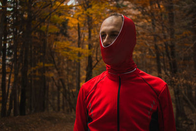 Portrait of man in forest during autumn