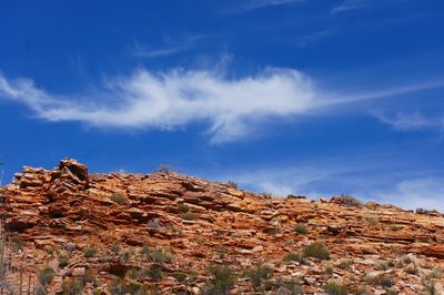 Rock formations on landscape against sky