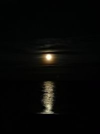 Scenic view of sea against sky at night