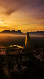 Aerial view of city buildings during sunset