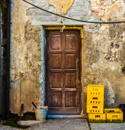 View of peeled wall with closed door