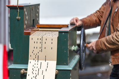 Close-up of hand holding machine