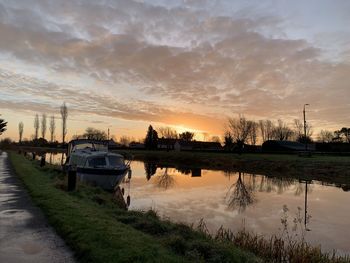 Scenic view of lake against sky during sunset