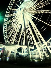Low angle view of illuminated ferris wheel