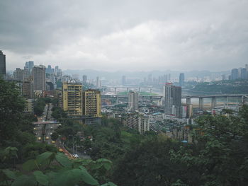 High angle view of buildings in city against sky