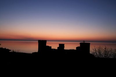 Silhouette of buildings at sunset