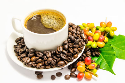 Close-up of coffee beans on white background