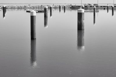 View of wooden posts on sea