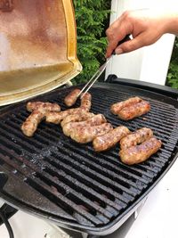 High angle view of meat cevapcici on barbecue grill