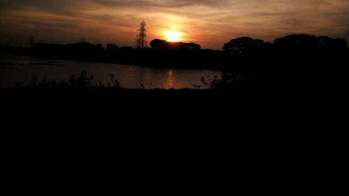 Scenic view of sunset over lake