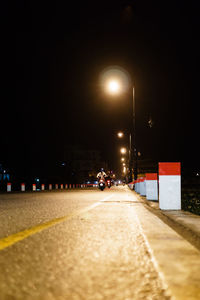 Illuminated street lights at night