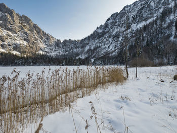 Scenic view of snow covered mountains against sky