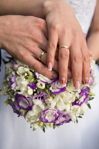 Close-up of couple holding hands