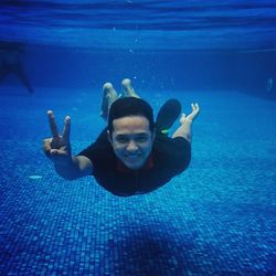 Portrait of boy swimming in sea