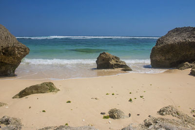 Scenic view of beach against clear sky