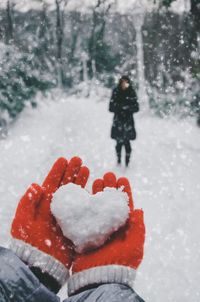 Close-up of person holding snow