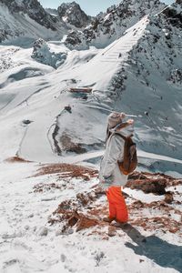 Full length of person on snowcapped mountains during winter