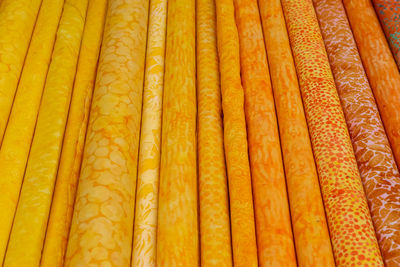 Detailed close up view on samples of cloth and fabrics in different colors found at a fabrics market