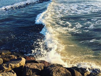 Waves splashing on rocks