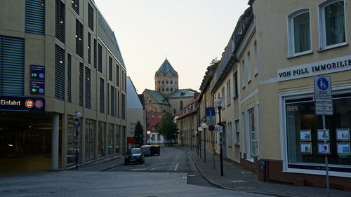 Street amidst buildings against sky