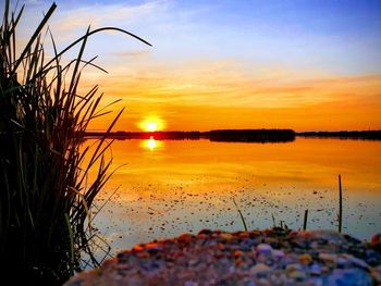 Scenic view of sea against sky during sunset