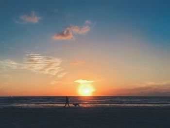 Scenic view of sea at sunset