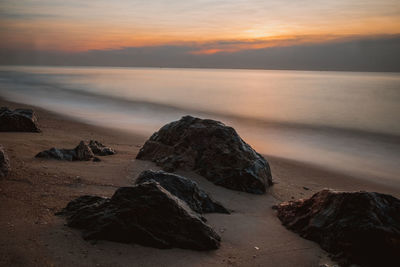 Sea rocks magnificent sunrise view at sunrise romantic atmosphere in peaceful morning at sea. 