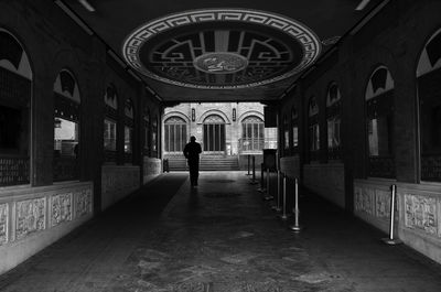 Rear view of man walking in church
