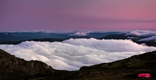 Panoramic view of silhouette mountains against sky during sunset