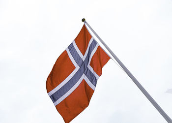 Low angle view of flag against sky