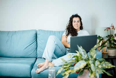 Young woman using laptop at home