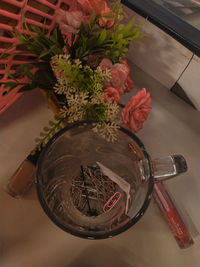 High angle view of various flowers in jar on table
