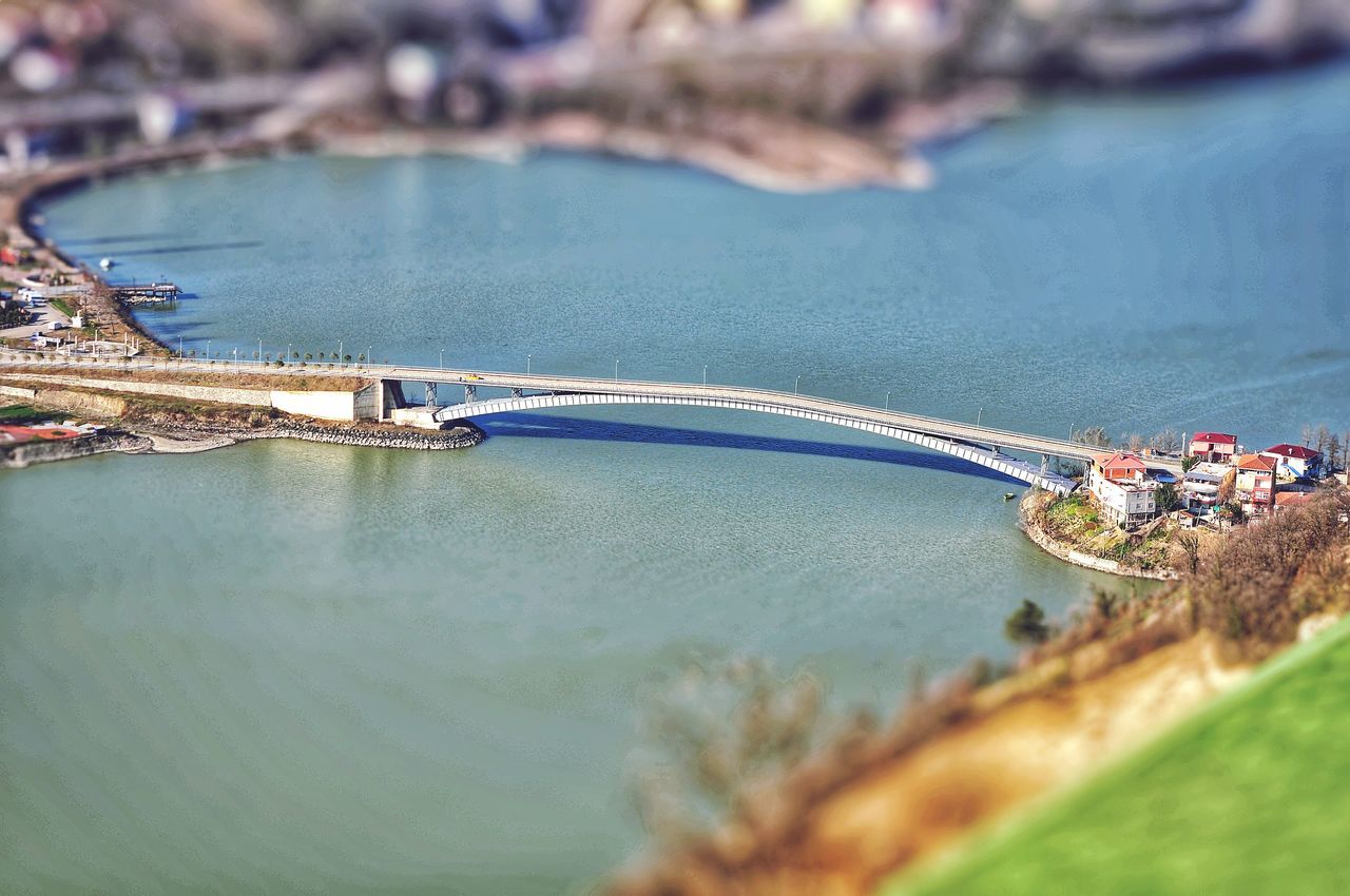 HIGH ANGLE VIEW OF SHIP MOORED AT SEA