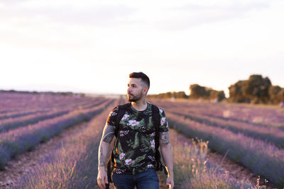 Full length of man standing on field against sky