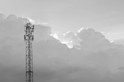 Low angle view of communications tower against sky