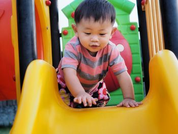 Baby boy on slide