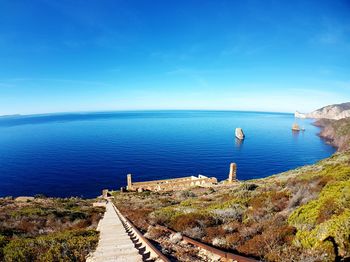 Scenic view of sea against clear blue sky