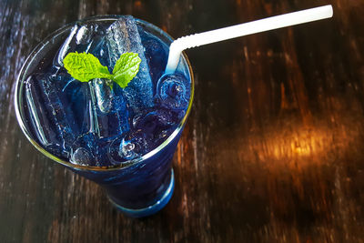 Close-up of ice cubes in glass on table