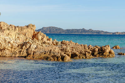 Panoramic view of sea and rocks against sky