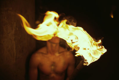 Close-up of fire burning at night